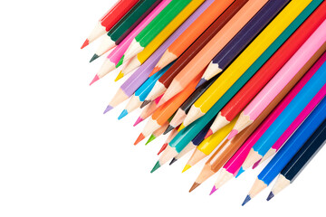 Wooden colored pencils isolated on a white background. A line of multicolored pencils in a large plan