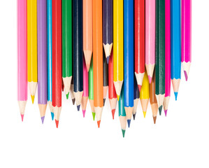 Wooden colored pencils isolated on a white background. A line of multicolored pencils in a large plan