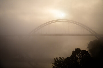 Fototapeta na wymiar The suspension bridge spanning a river in Nashville, Tennessee in America