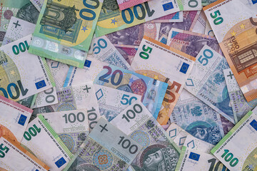 pile of polish banknotes zlotys and euros