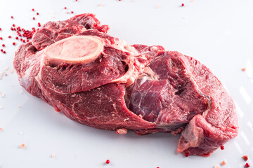 Raw beef meat on bone on white background