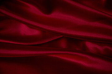 Naklejka na ściany i meble Beautiful draped silk fabric in red.