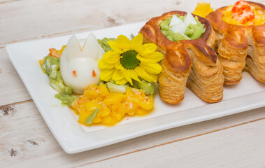 Puff pastry vol-au-vents shaped like an easter bunny filled with mango and avocado