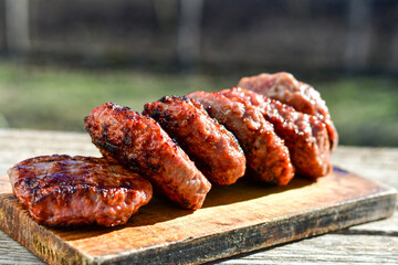 Home made Grilled pork meatballs  outdoor on wooden rustic background