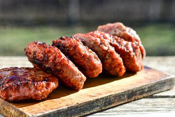 Home made Grilled pork meatballs  outdoor on wooden rustic background