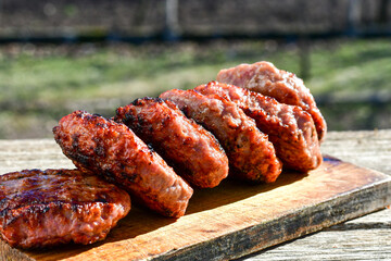 Home made Grilled pork meatballs  outdoor on wooden rustic background