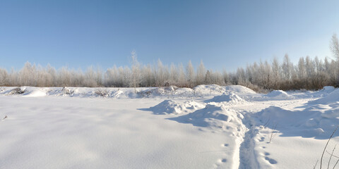 Winter walk through forests and fields, beautiful panorama.