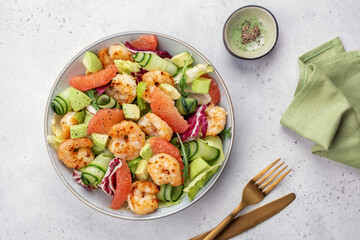 Delicious fresh salad with shrimp prawns, grapefruit, avocado, cucumber and green salad. Healthy food.