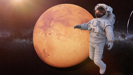 astronaut during spacewalk in orbit of planet Mars 