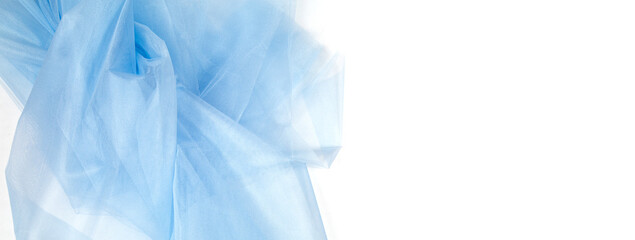 Beautiful delicate blue background mesh fluffy fabric. Banner. elegant pastel light blue tulle