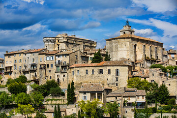Fototapeta premium The Castle and the Church of Saint Fermin (Firmin) Crowning the City of Gordes, Provence, France