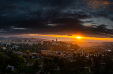 Fototapeta premium Sky view of an amazing dramatic sunrise over Jerusalem old city in Israel