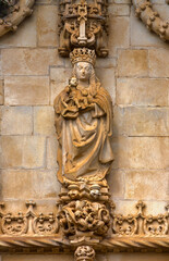 Fototapeta na wymiar Sculpture of the Virgin with the Blessing Child above the Entrance of the Convent Church, Convent of Christ, Tomar, Portugal