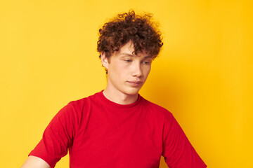 portrait of a young curly man summer style fashion posing isolated background unaltered