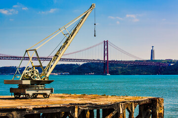 Old Crane near the 25th of April Bridge, Crossing the River Tagus, Lisbon, Portugal