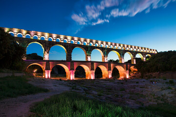 Night Shot of the Aqueduct Pont du Gard Crossing the Gardon River, Occitanie, France