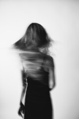 Art portrait of a girl in black and white. Light defocus and art noise on the frames