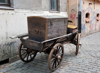 Medieval wooden cart on the street of the old European city.