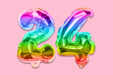 Rainbow foil balloon number, digit twenty four on a pink background. Birthday greeting card with inscription 24. Top view. Numerical digit. Celebration event, template.