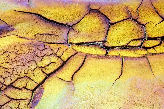 Full frame of dry cracked soil on bank of Rio Tinto