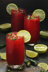 Jalapeno tomato margarita cocktail with lime