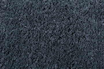 Carpet texture background. Black gray cotton carpet for floor coverings. Material for interior design and decoration of living rooms