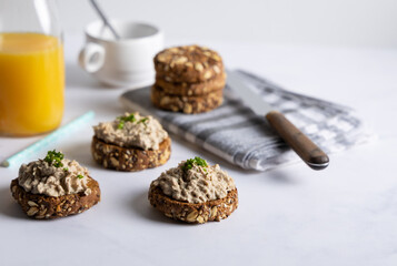 Homemade vegan tuna spread. Homemade vegan tuna spread served on whole grain bread, with a coffee...