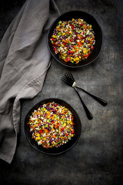 Studio shot of two bowls of colorful vegan salad