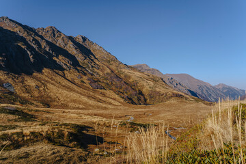 Brown mountains in front of blue sky, Caucasus, Sochi, Russia