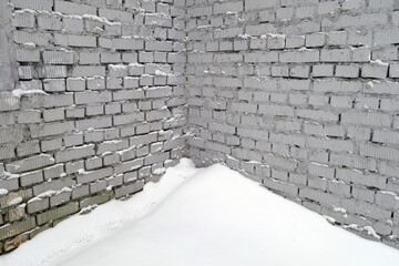 Brick wall in snow.