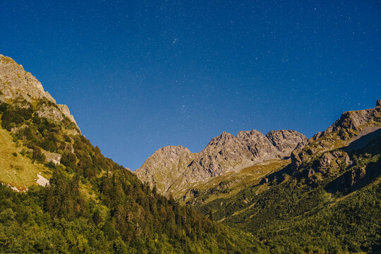 Caucasus mountain range with star field at night, Sochi, Russia
