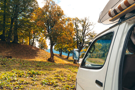 Camper van in autumn forest, Sochi, Krasnaya Polyana, Russia