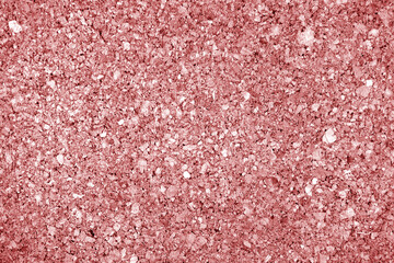 Cork board texture in red tone.