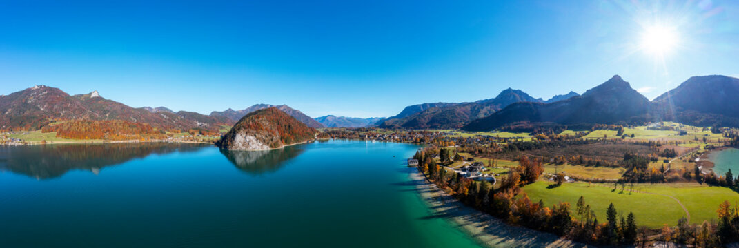Austria, Salzburg, Strobl, Drone panorama of Lake Wolfgang and surrounding landscape on sunny autumn day