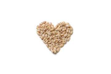 Oat grain folded in the shape of a heart on a white isolated background, top view.