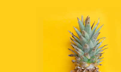 Fototapeta na wymiar pineapple tropical fruit on yellow. Minamal, vitamin pineapple, vegan diet food. sweet fresh fruits. Creative concept background, textures open space