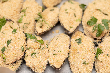 Snack meal portions on seashell on baking tray