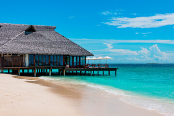 picturesque sandy beach in Maldives island near water villa, concept of luxury travel, beautiful exotic tropical landscape