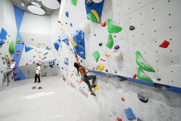 Young girl bouldering