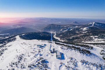 Fototapeta na wymiar Sheregesh ski lift resort winter, landscape mountain and hotels, aerial top view Russia Kemerovo region
