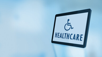Wheelchair Symbol and Healthcare Text On A Digital Tablet Screen