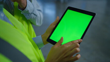 Factory workers checking seen screen tablet analysing information hands closeup