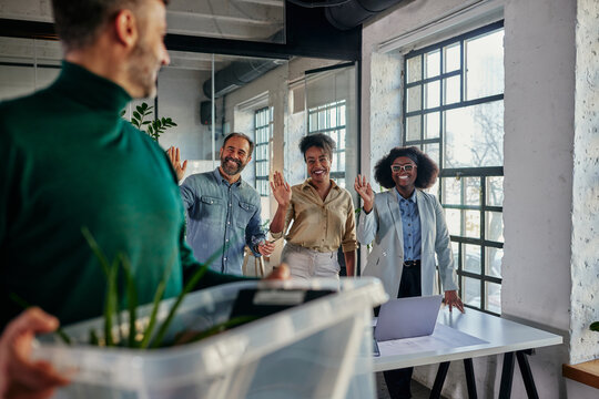 Multiracial colleagues welcomed man who return to work