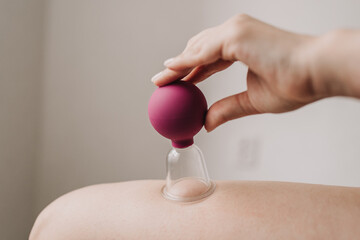 Cupping massage anti-cellulite on a white background
