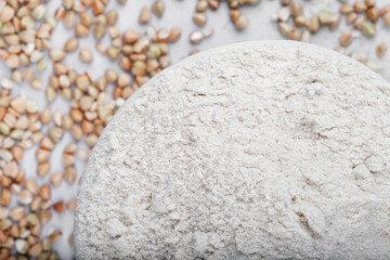 Fototapeta na wymiar Flour green buckwheat on a light concrete background top view. Green Buckwheat Flour - Gluten Free Alternative Flour