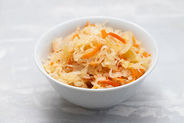 salted cabbage with carrot in white bowl