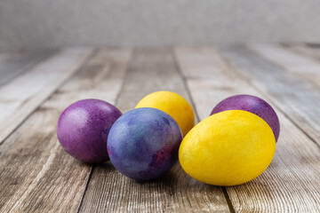 Easter eggs on a wooden table. Multicolored eggs. Easter.Photo