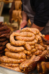 Ham, hamon iberico, pancetta, chorizo, kulen, prsut i fresh kobasice sausages on the traditional meat food market in Belo Blato, Serbia