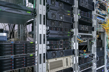 There are racks with server computers in the data center. Powerful computing equipment is on the technical site of the Internet provider.