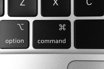 Command key and button on keyboard. Command sign close-up. Modern laptop, communication concept photo